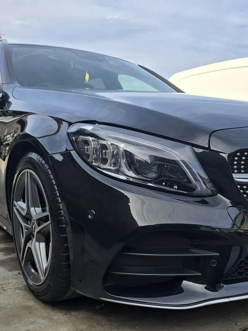 Front of the client’s black Mercedes with clean paint and trim